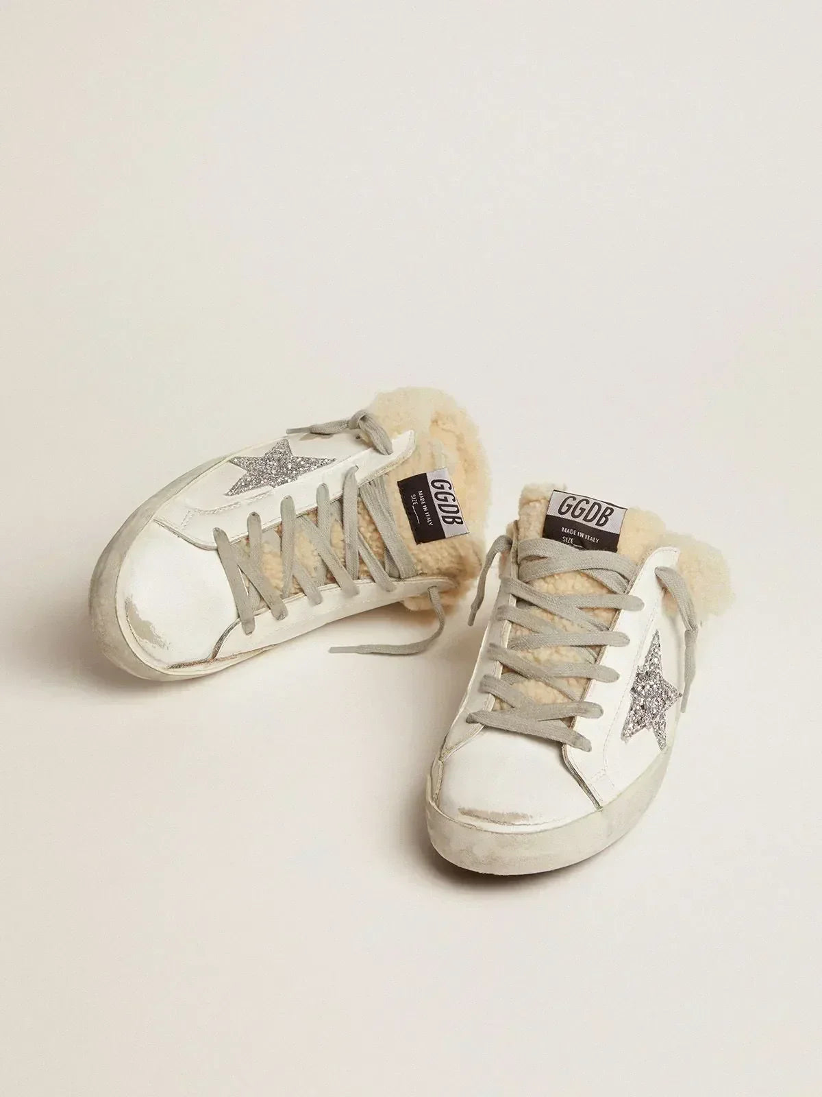 Super-Star Sabots in white leather with silver glitter star and shearling lining