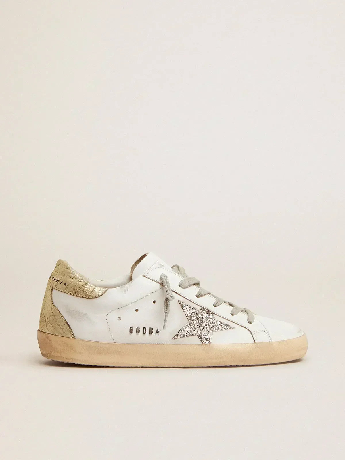 Super-Star sneakers with silver glitter star and glossy gold leather heel tab