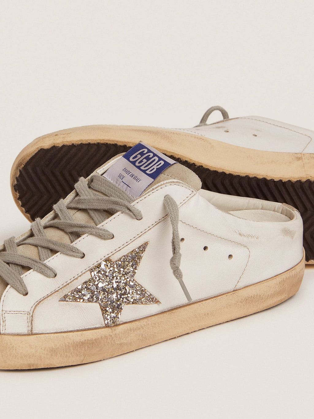 Super-Star Sabot with a platinum glitter star and suede tongue